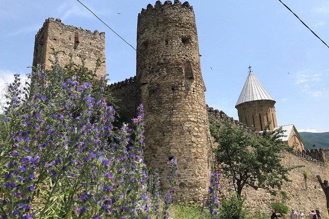 Kazbegi Day Trip (Jinvali, Ananuri, Gudauri, Gergeti church) - Ananuri Fortress: stone walls beside the Aragvi