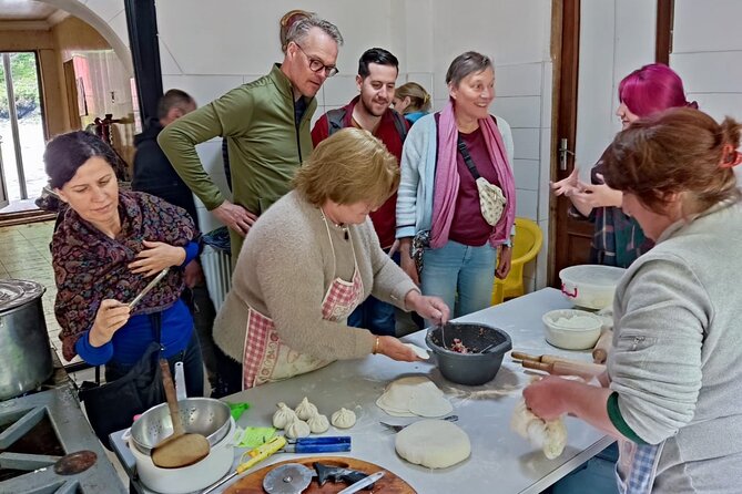 Military Road Marvels: Ananuri, Kazbegi & Khinkali Masterclass - Gergeti Trinity Church beneath Mount Kazbegi