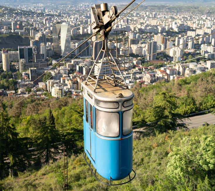Tbilisi: Old and New City Guided Tour with 2 Cable Car Rides - What the guide adds to a short tour
