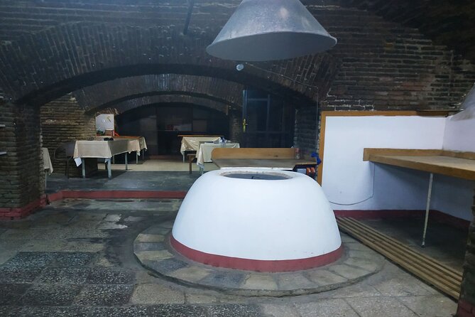 Tbilisi Walking Tour with Cable Car, Wine Tasting & Bread Bite - Narikala Fortress above the rooftops